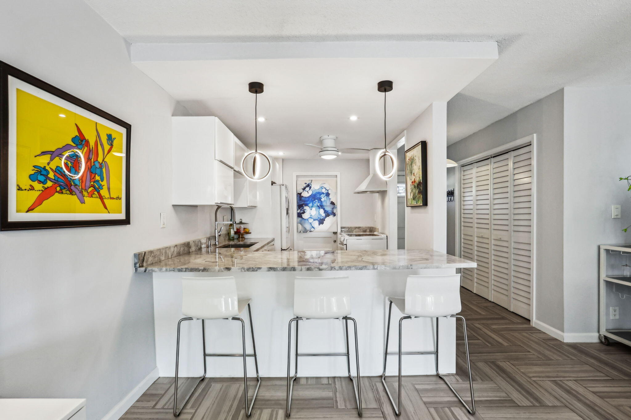 698 Northeast Spanish River Boulevard, Unit 24 Boca Raton, FL 33431 - Photo 8 of 25 a view of a dining room with furniture and wooden floor