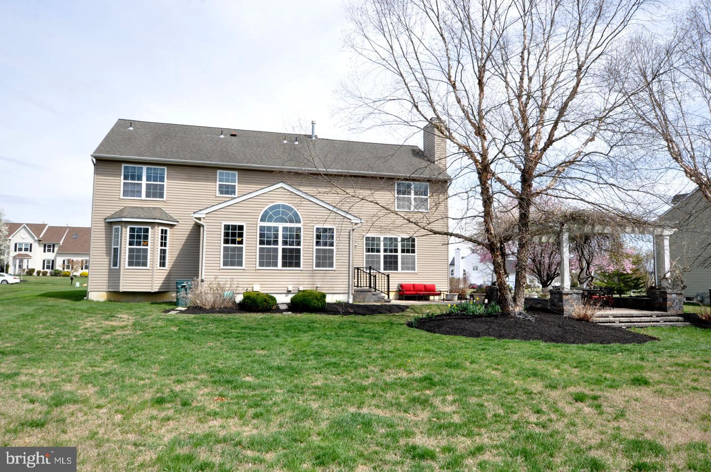 261 Jennings Way Mickleton, NJ 08056 - Photo 11 of 46 a view of a white house with a big yard and large trees