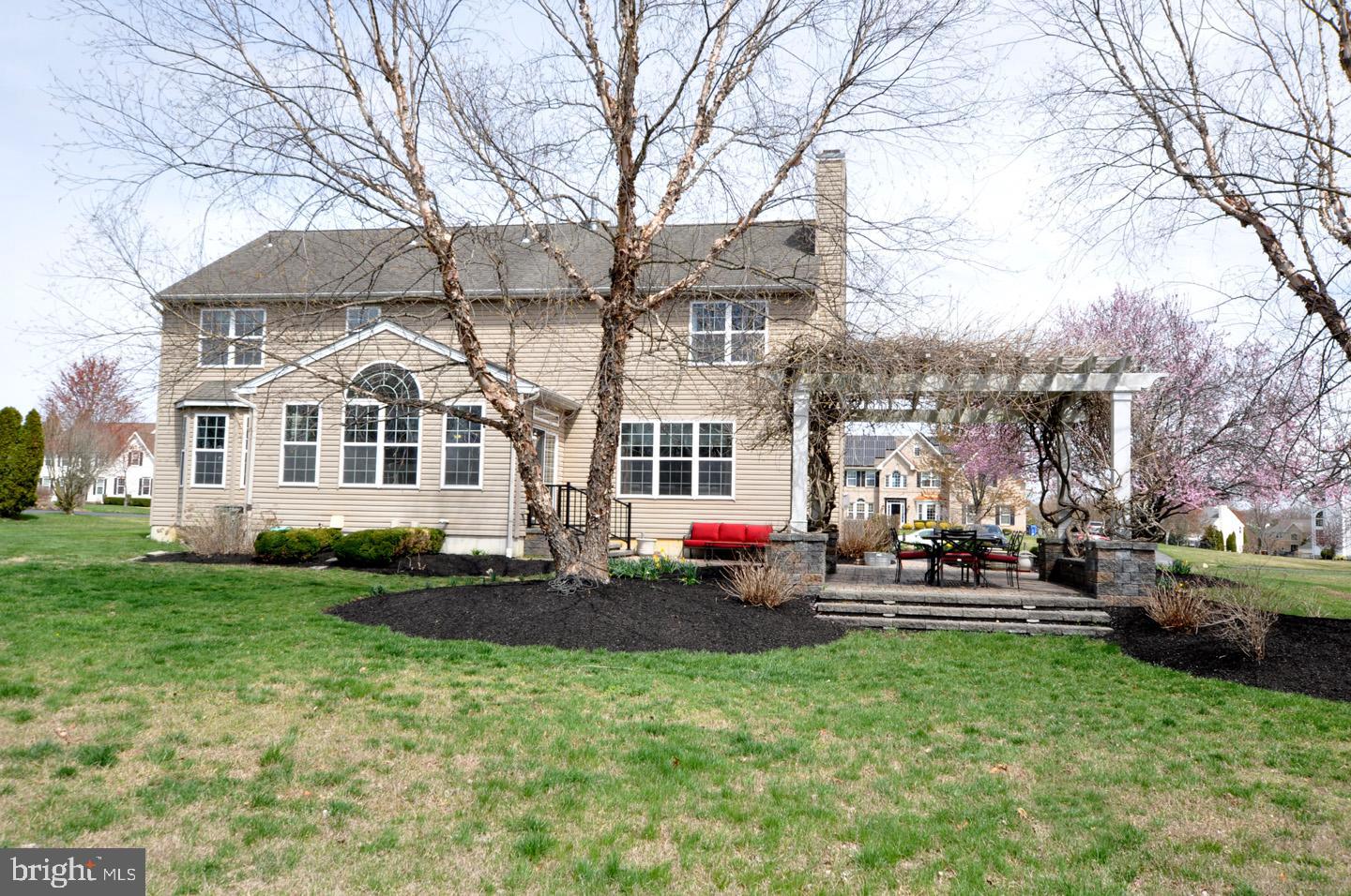 261 Jennings Way Mickleton, NJ 08056 - Photo 12 of 46 a front view of a house with a yard and trees