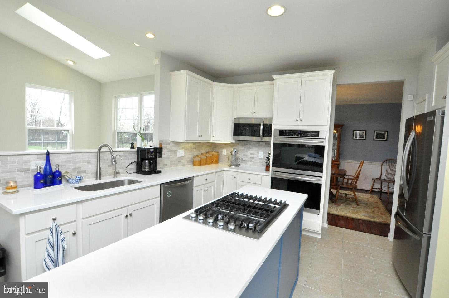 261 Jennings Way Mickleton, NJ 08056 - Photo 15 of 46 a kitchen with a sink stove and refrigerator