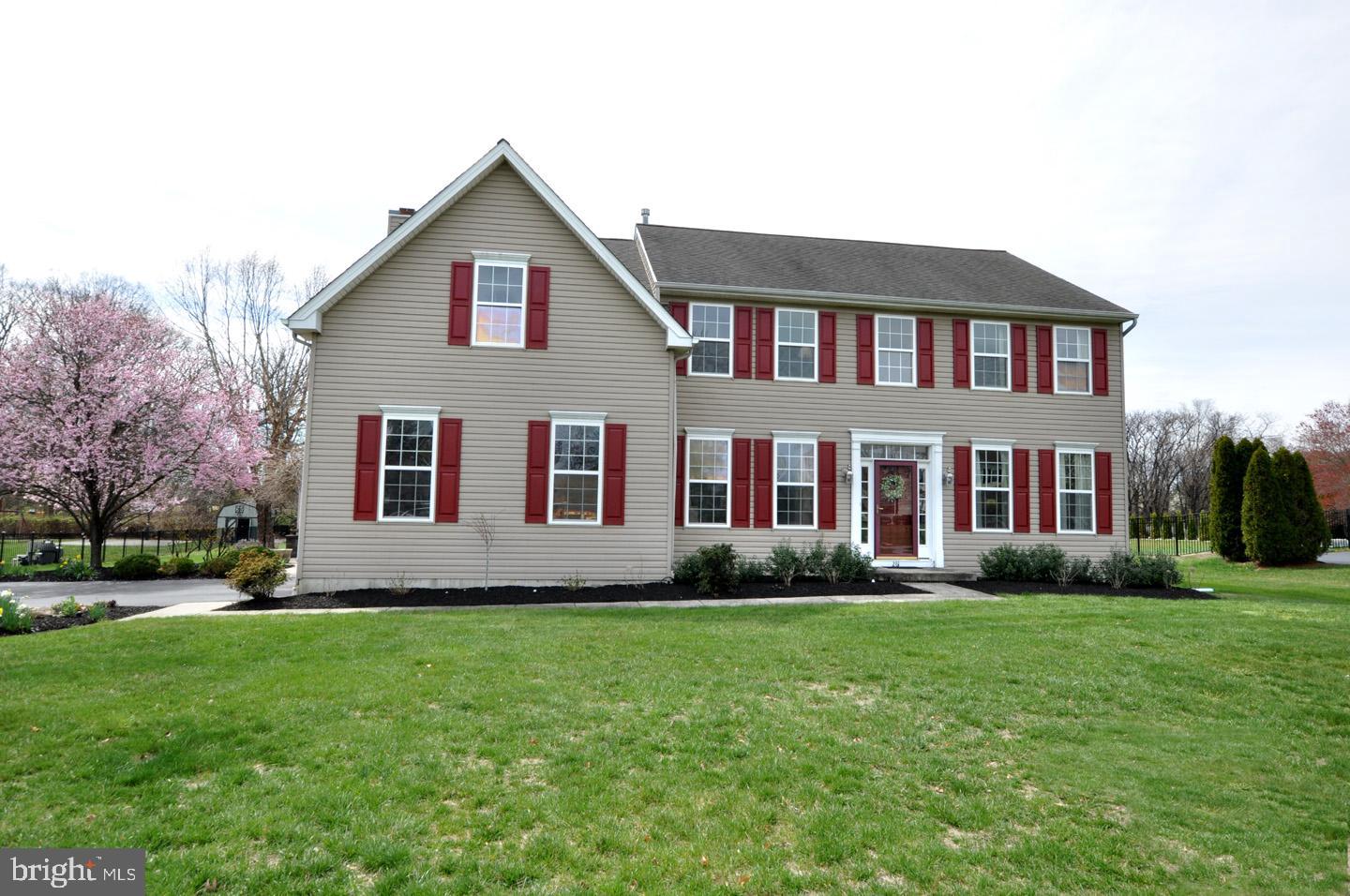 261 Jennings Way Mickleton, NJ 08056 - Photo 2 of 46 a front view of a house with a garden and yard