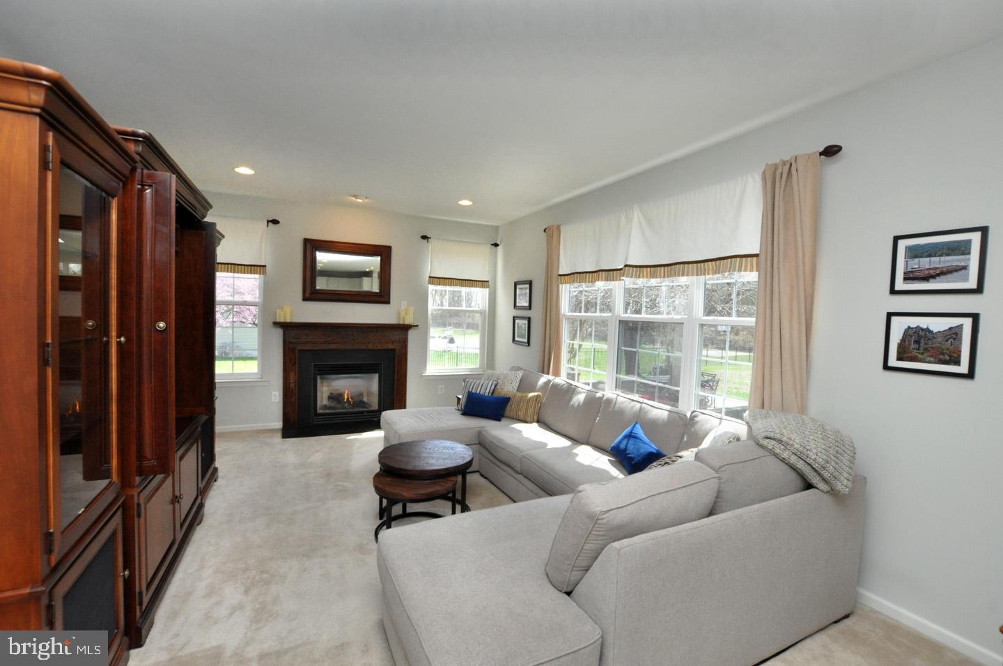 261 Jennings Way Mickleton, NJ 08056 - Photo 22 of 46 a living room with furniture and a fireplace