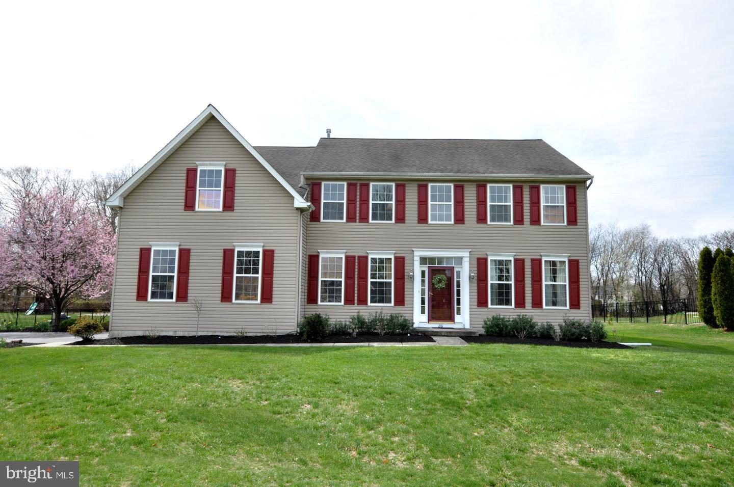 261 Jennings Way Mickleton, NJ 08056 - Photo 3 of 46 a front view of a house with a yard