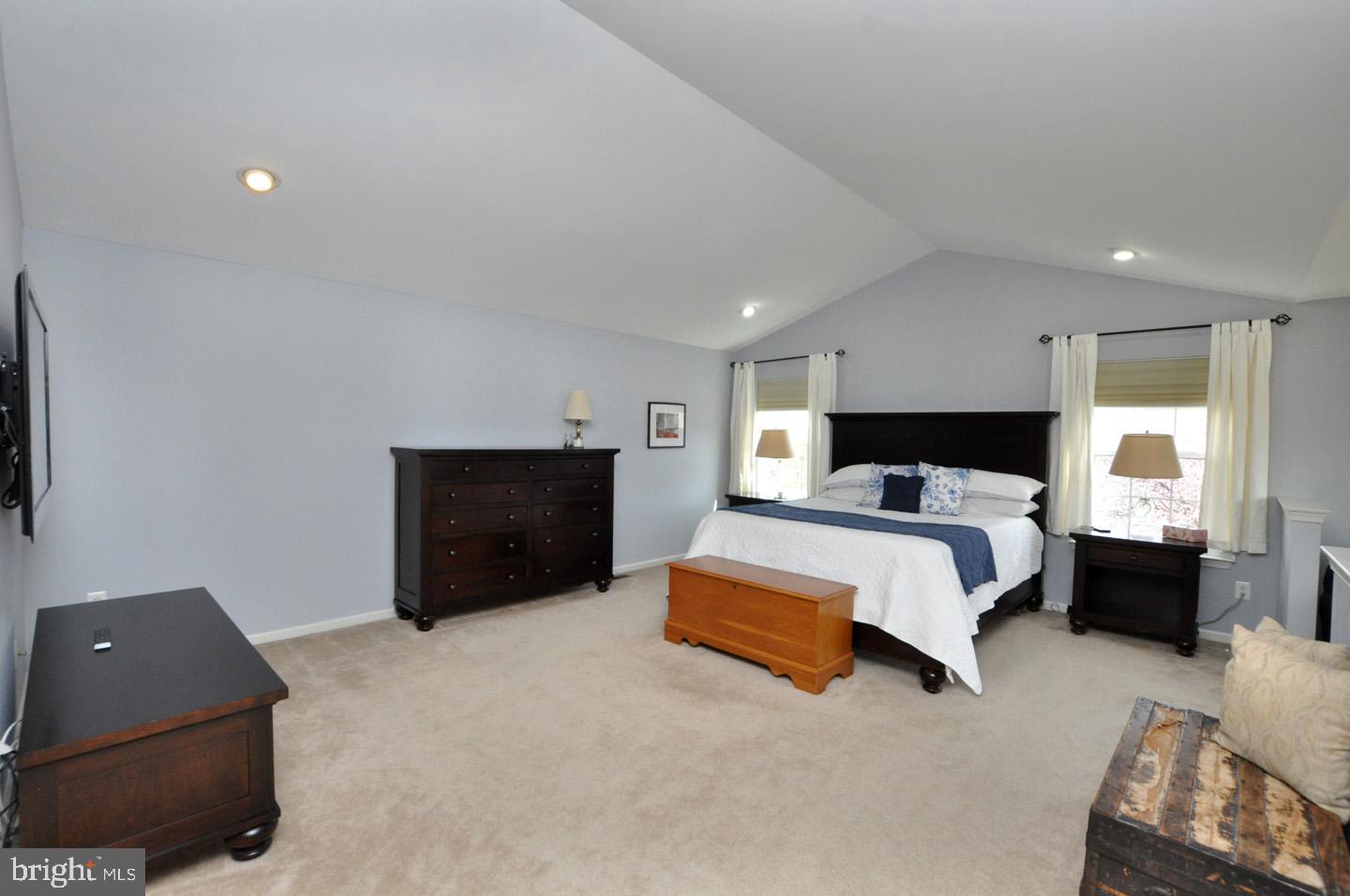 261 Jennings Way Mickleton, NJ 08056 - Photo 31 of 46 a spacious bedroom with a bed and a couch