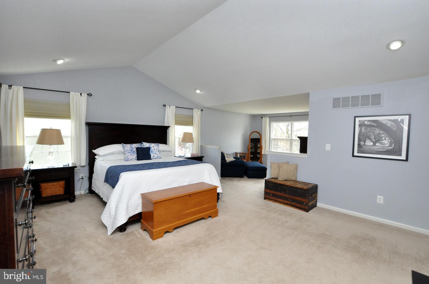 261 Jennings Way Mickleton, NJ 08056 - Photo 32 of 46 a spacious bedroom with a bed a couch and dresser