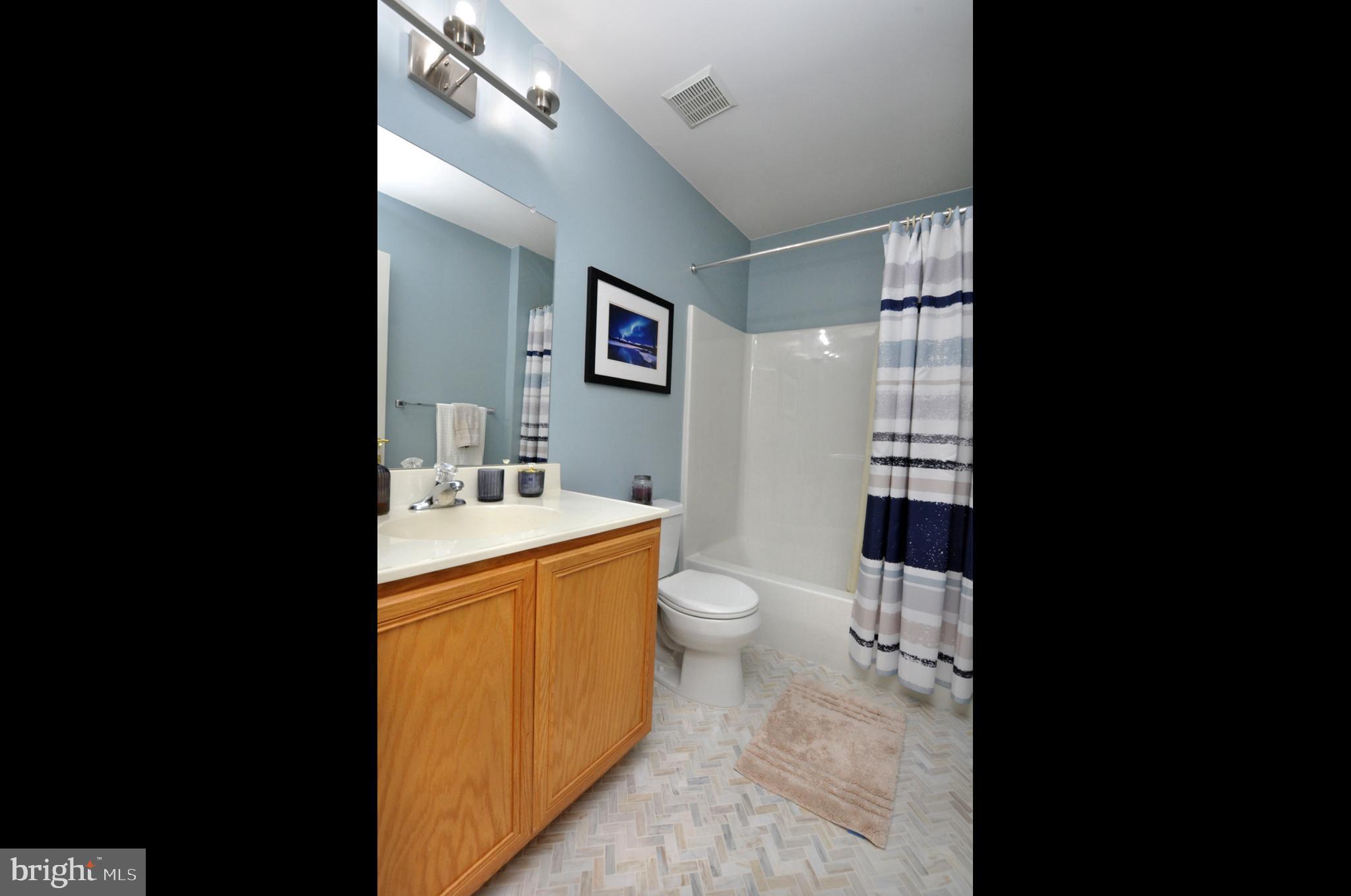 261 Jennings Way Mickleton, NJ 08056 - Photo 43 of 46 a bathroom with a sink toilet and shower