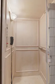 a bedroom with a large bed and a dresser