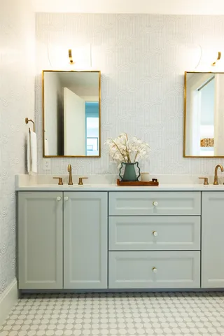 a bathroom with a sink vanity and mirror