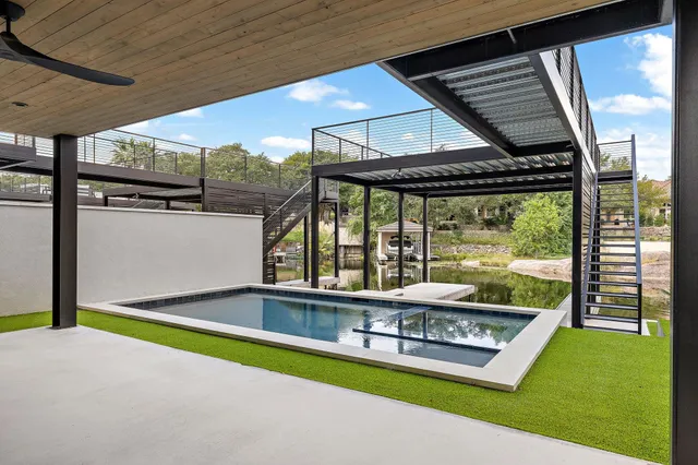 a view of swimming pool with a yard