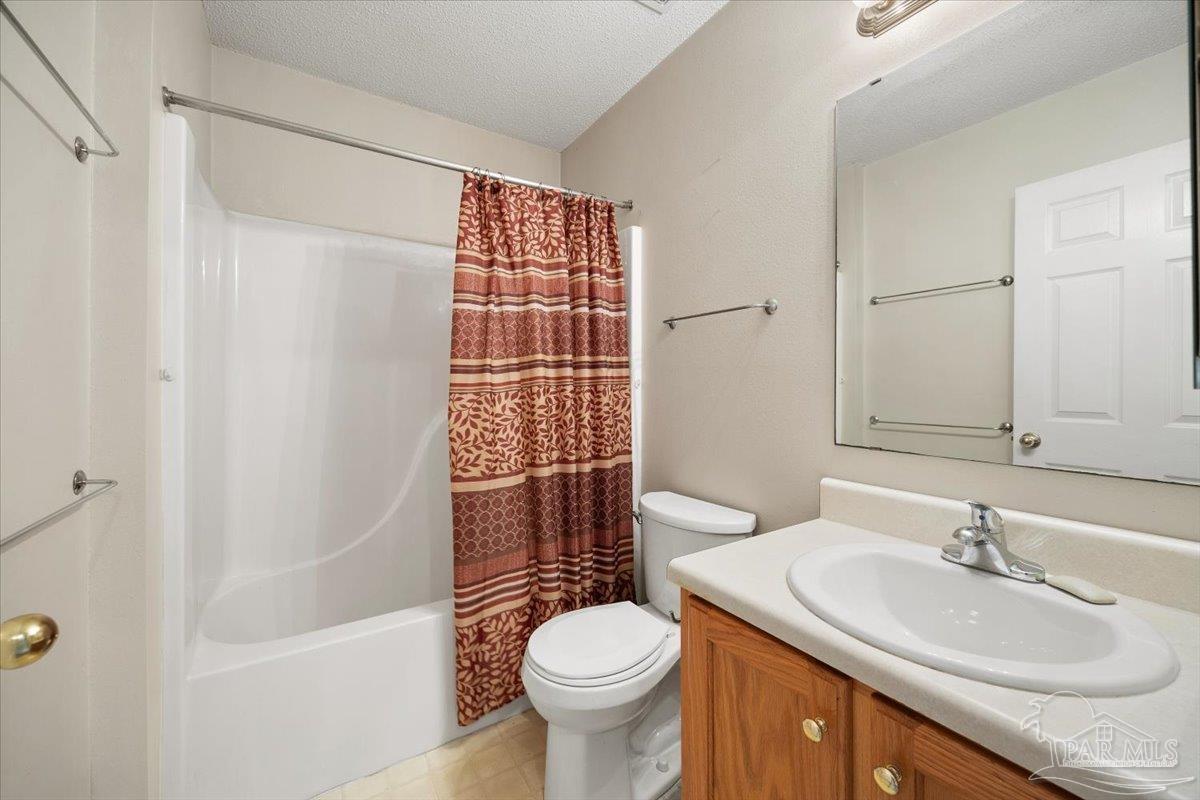 6892 Yucatan Street Milton, FL 32570 - Photo 11 of 41 a bathroom with a sink toilet and shower