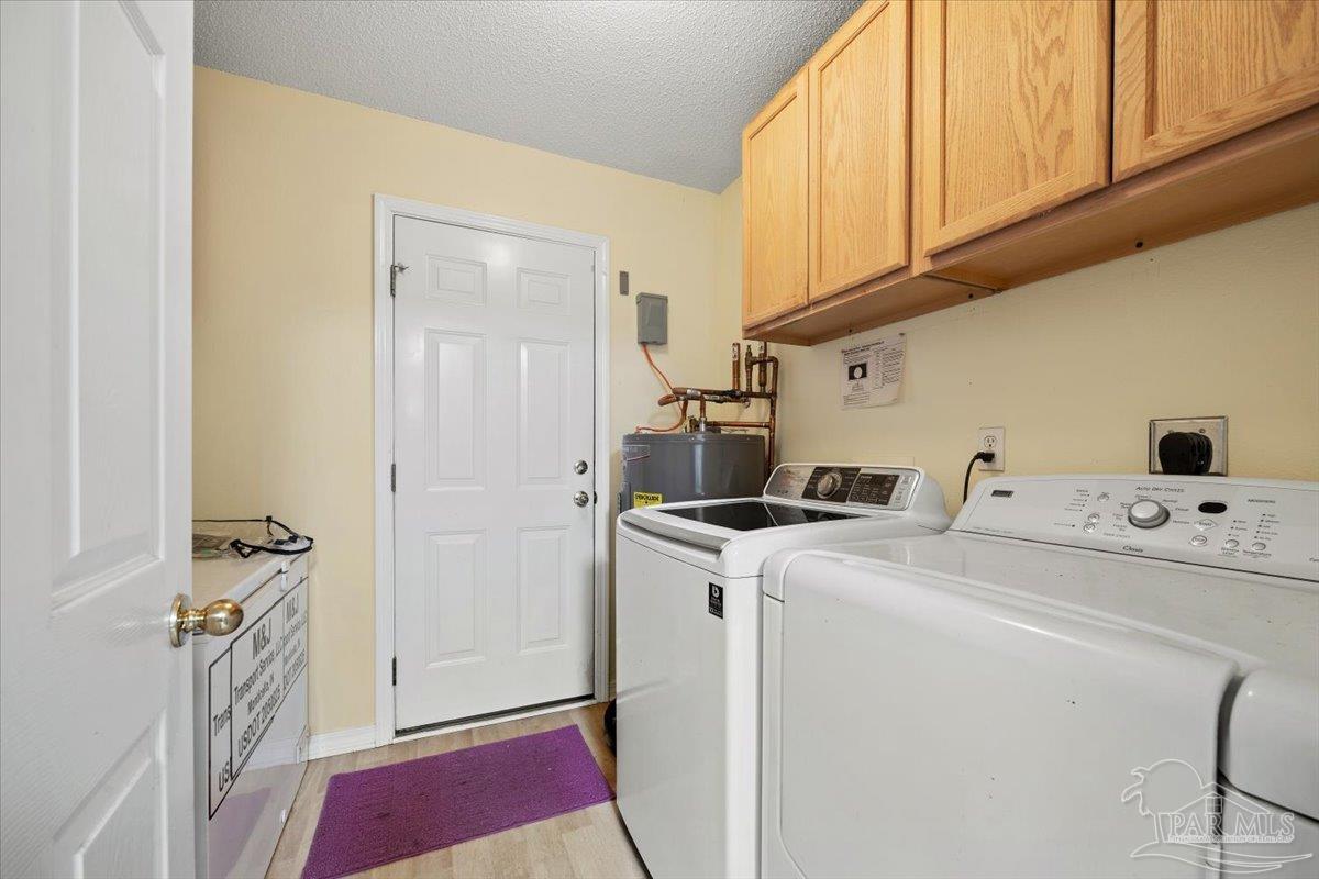 6892 Yucatan Street Milton, FL 32570 - Photo 17 of 41 a utility room with dryer and washer