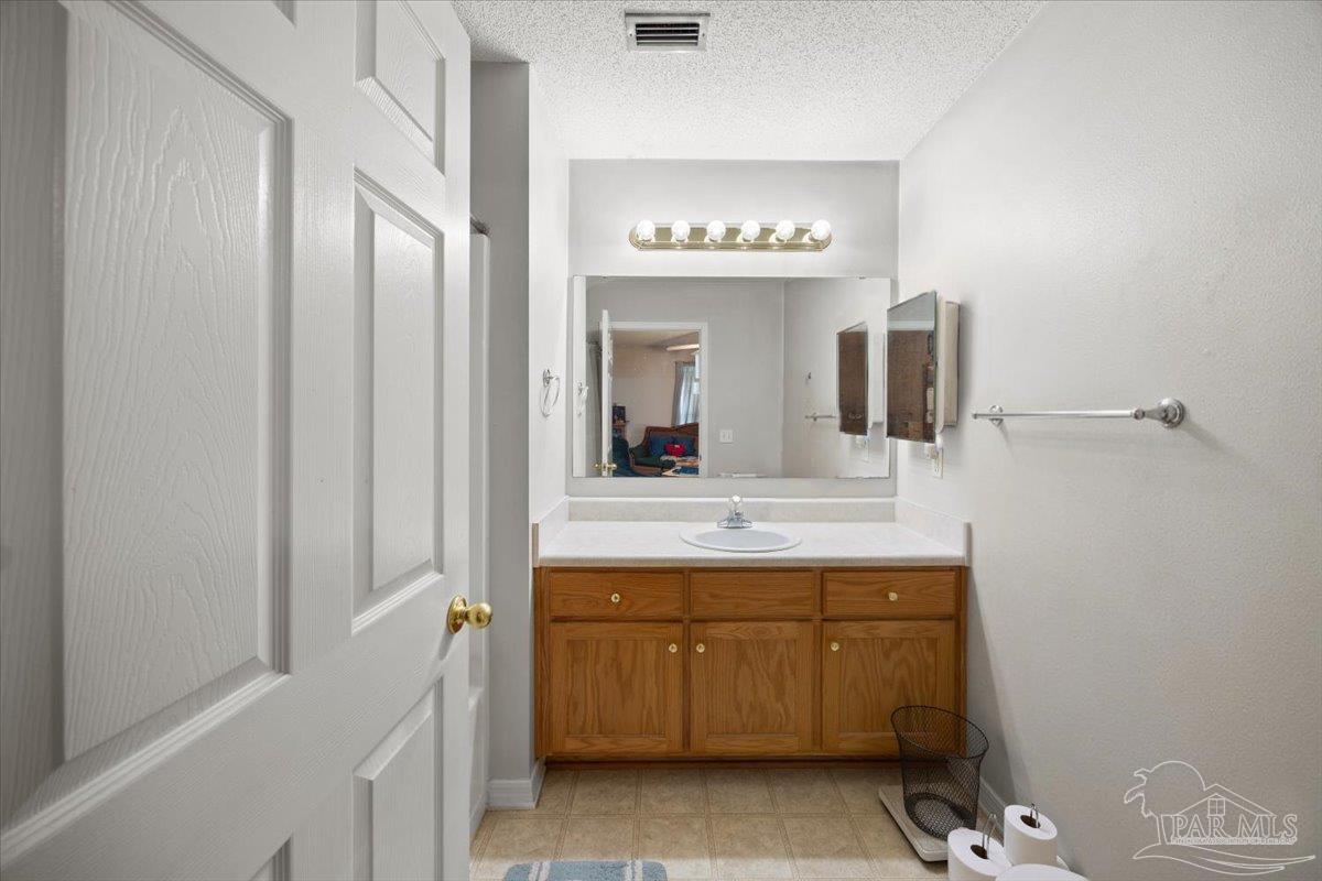 6892 Yucatan Street Milton, FL 32570 - Photo 18 of 41 a bathroom with a sink and a mirror