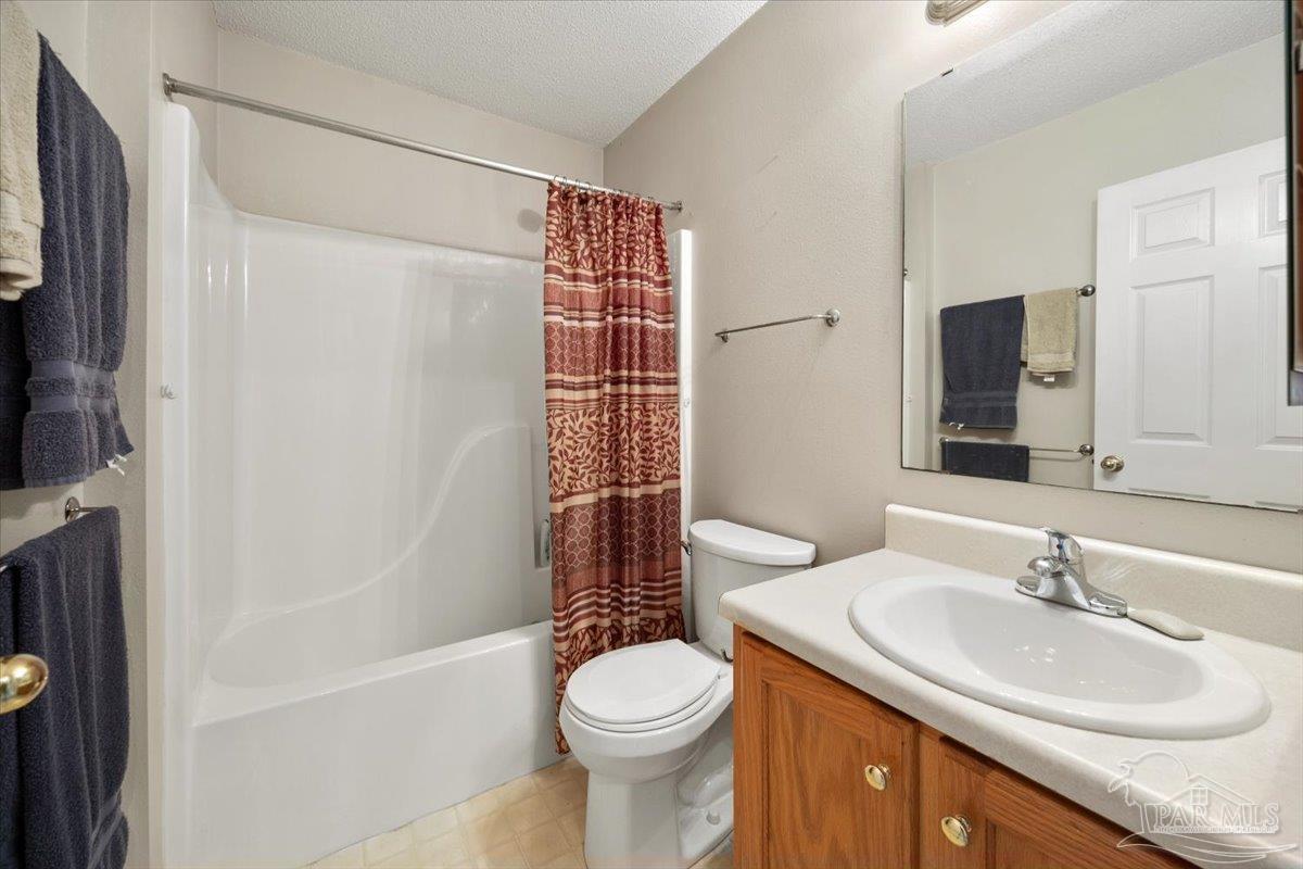 6892 Yucatan Street Milton, FL 32570 - Photo 20 of 41 a bathroom with a sink toilet and shower
