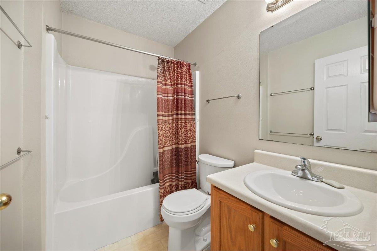 6892 Yucatan Street Milton, FL 32570 - Photo 22 of 41 a bathroom with a sink toilet and shower