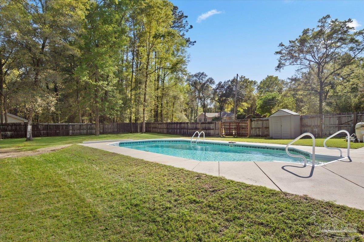 6892 Yucatan Street Milton, FL 32570 - Photo 25 of 41 a view of a park with large trees