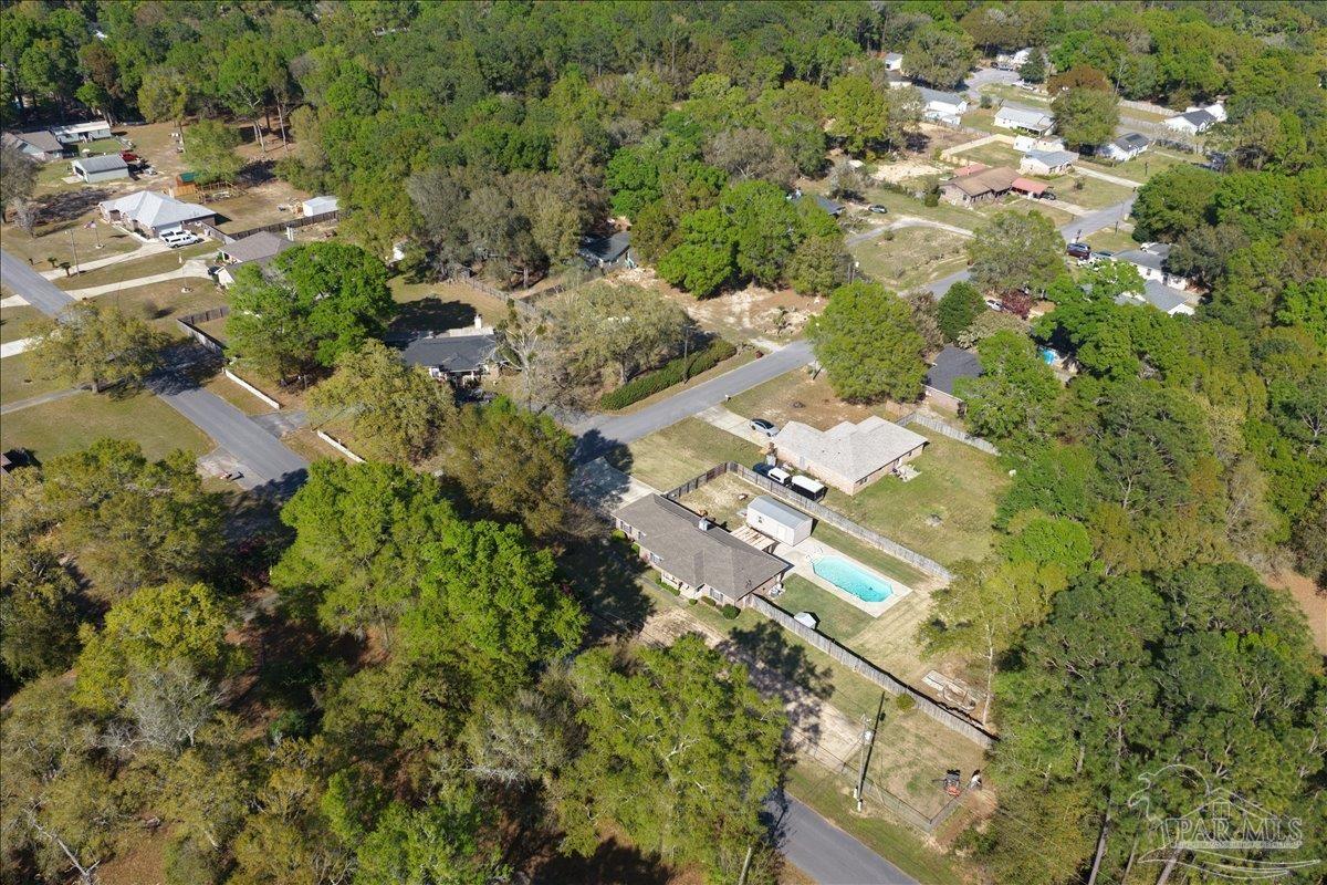 6892 Yucatan Street Milton, FL 32570 - Photo 34 of 41 an aerial view of residential houses with outdoor space