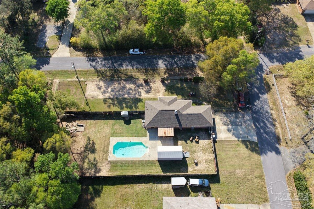 6892 Yucatan Street Milton, FL 32570 - Photo 37 of 41 an aerial view of a house with swimming pool and lake view