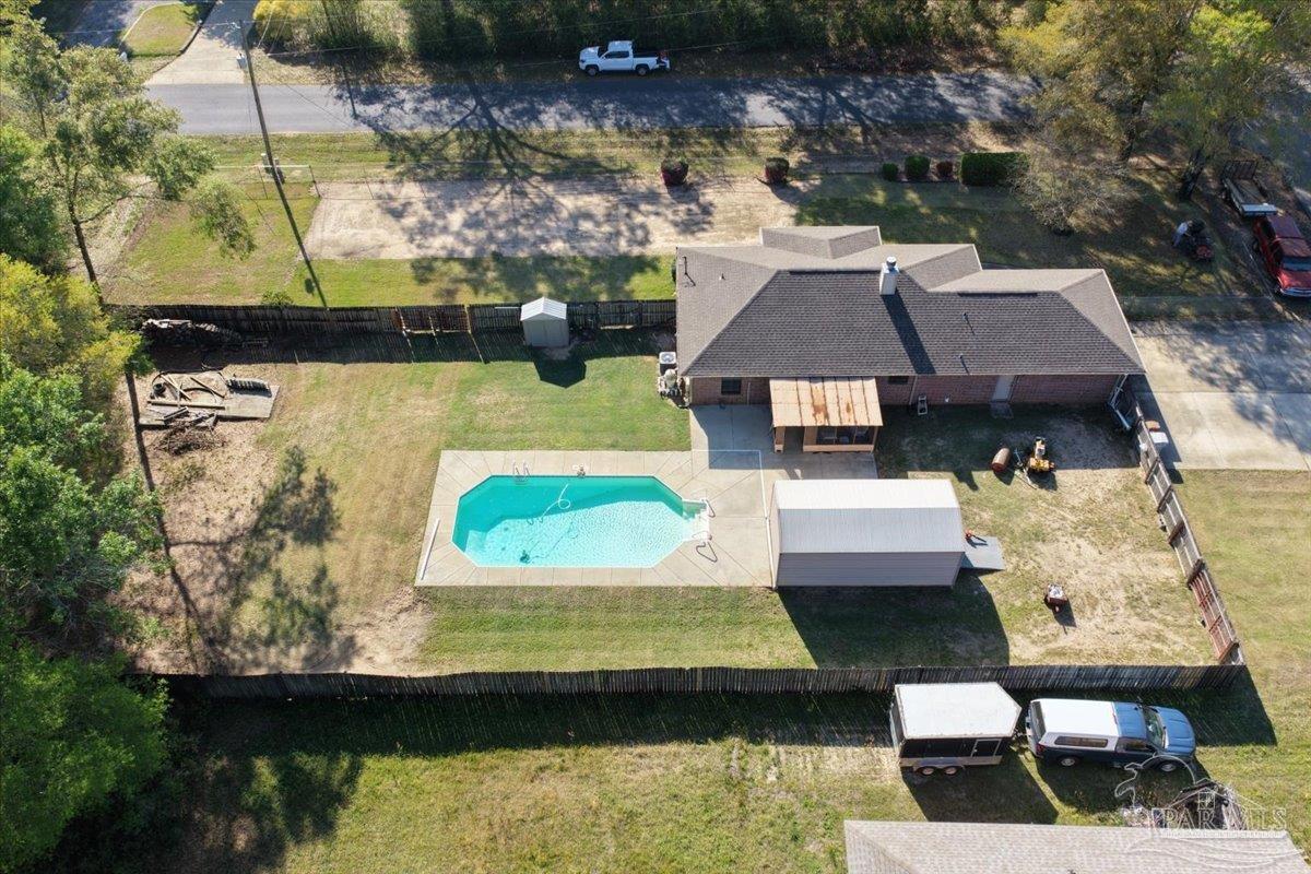 6892 Yucatan Street Milton, FL 32570 - Photo 40 of 41 a aerial view of a house with swimming pool