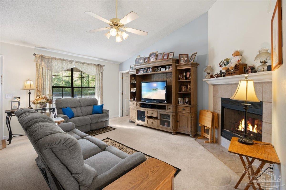 6892 Yucatan Street Milton, FL 32570 - Photo 4 of 41 a living room with furniture and a flat screen tv
