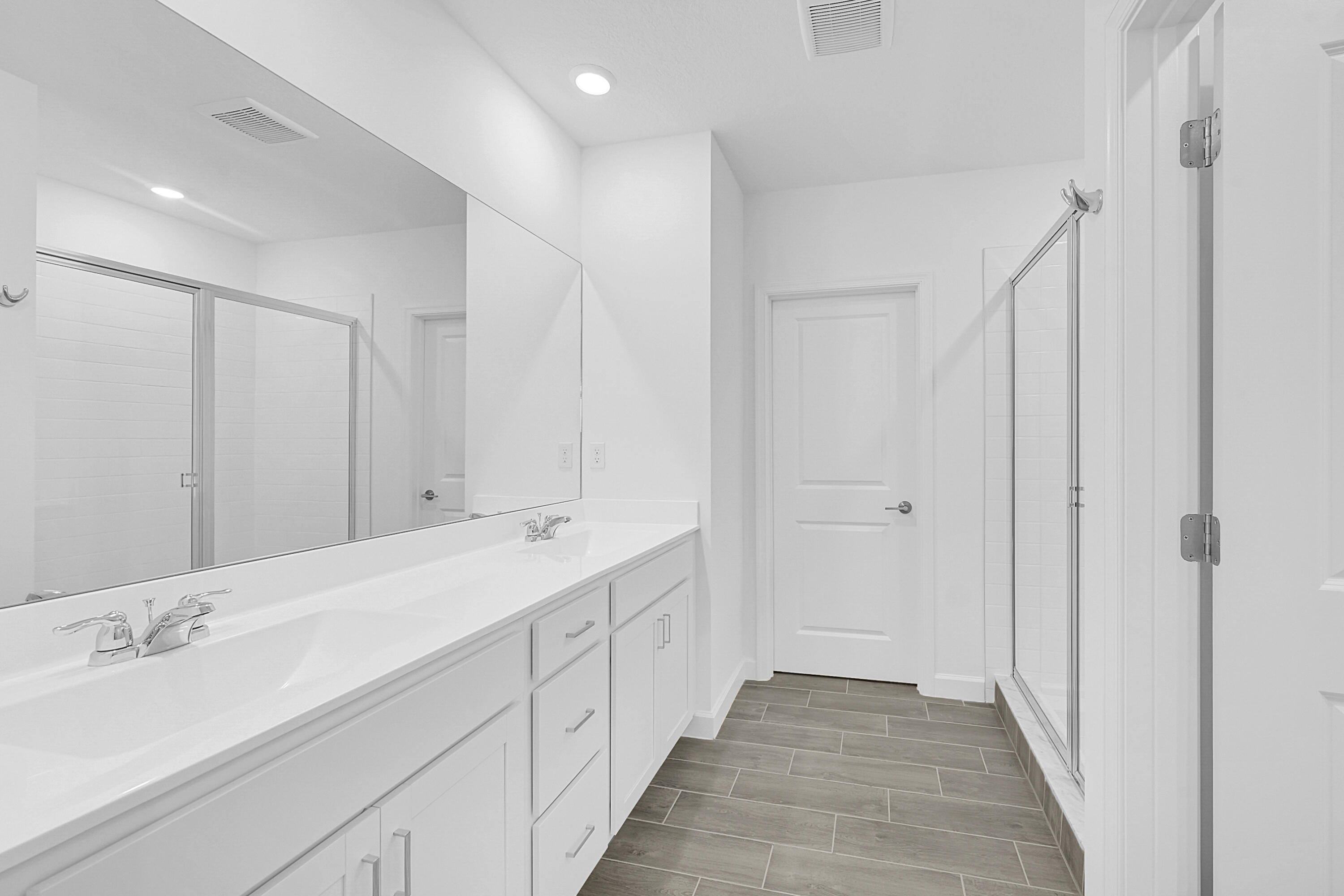 3514 Angler Drive Fort Pierce, FL 34946 - Photo 19 of 32 a bathroom with a double vanity sink and a mirror