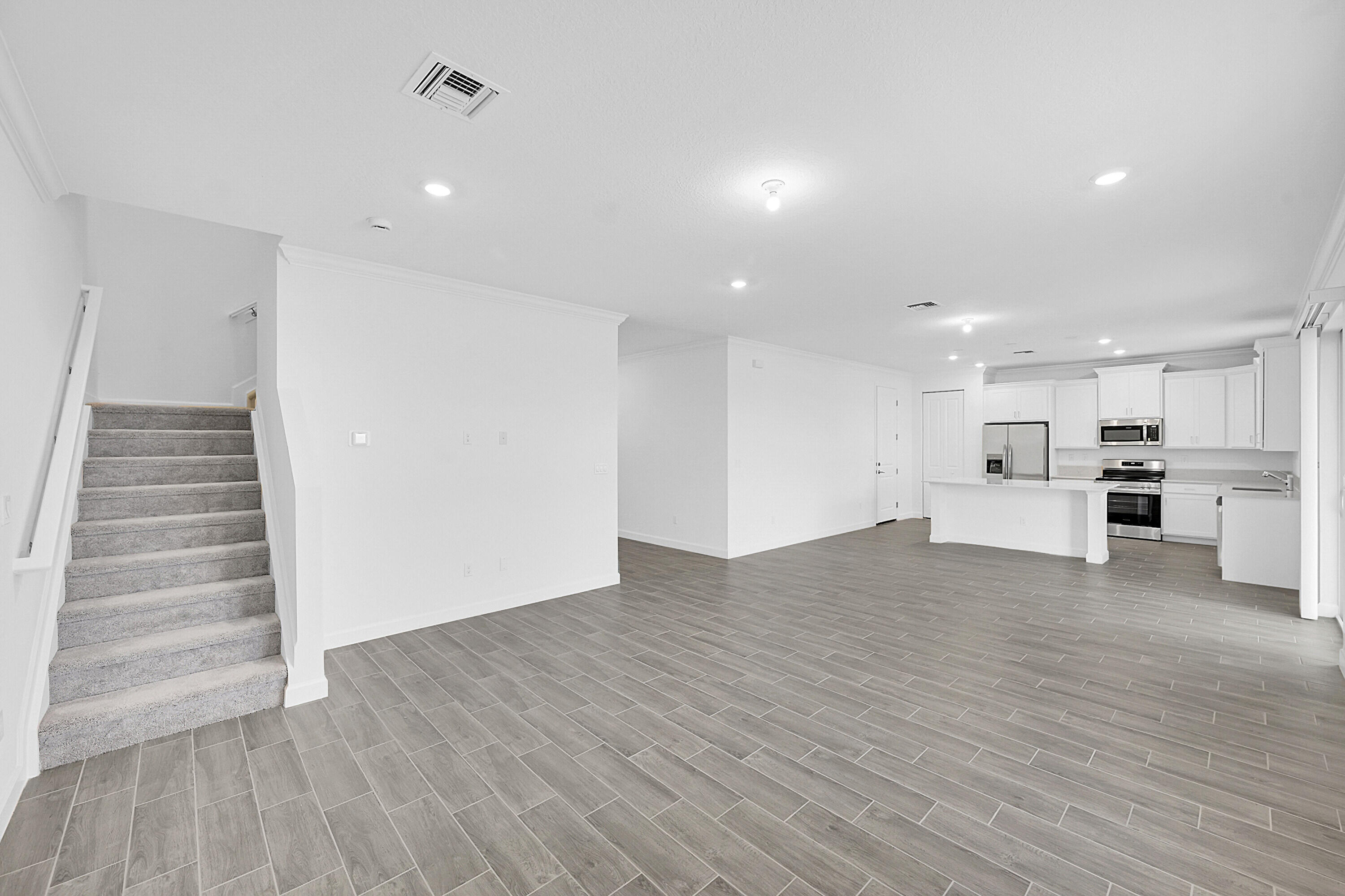 3514 Angler Drive Fort Pierce, FL 34946 - Photo 8 of 32 a view of kitchen with wooden floor and electronic appliances