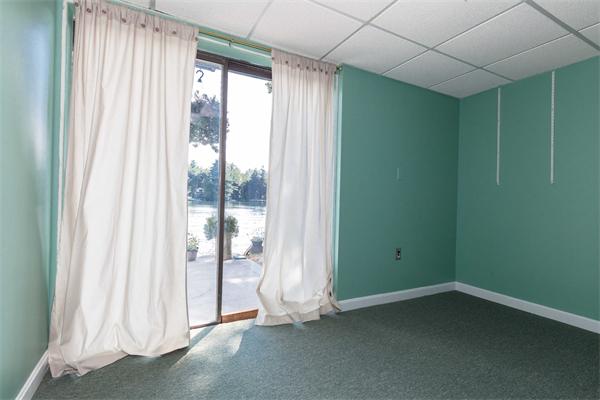 76 Pine Point Road Stow, MA 01775 - Photo 11 of 17 a view of an empty room with a window