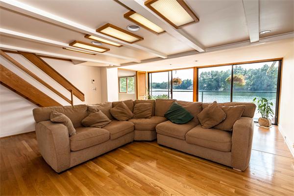 76 Pine Point Road Stow, MA 01775 - Photo 5 of 17 a living room with furniture and a large window