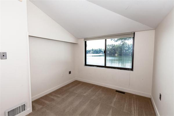 76 Pine Point Road Stow, MA 01775 - Photo 8 of 17 an empty room with a window