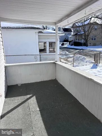 a living room with stainless steel appliances granite countertop lots of counter top space