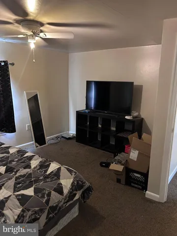 a room with furniture and a flat screen tv