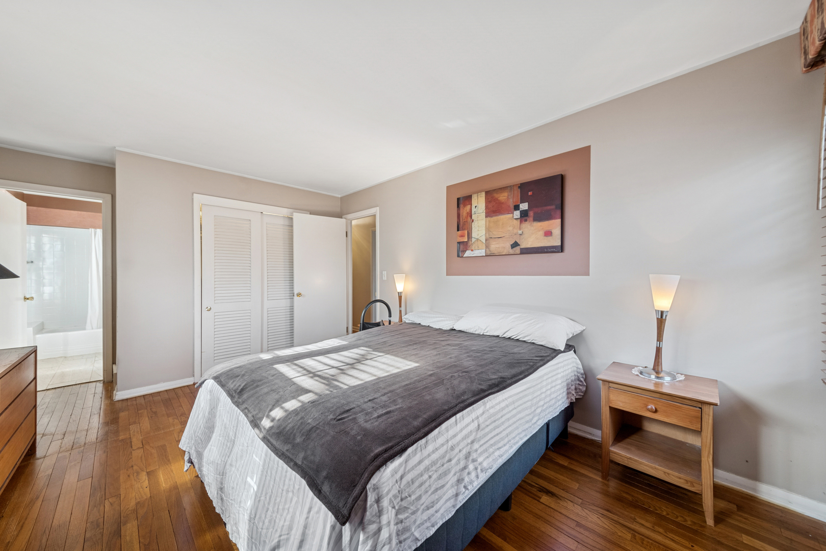 532 Shabbona Trail Batavia, IL 60510 - Photo 15 of 19 a spacious bedroom with a bed and wooden floor