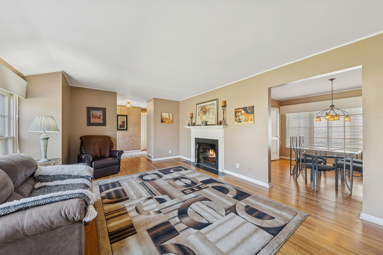 532 Shabbona Trail Batavia, IL 60510 - Photo 3 of 19 a living room with furniture a fireplace and wooden floor