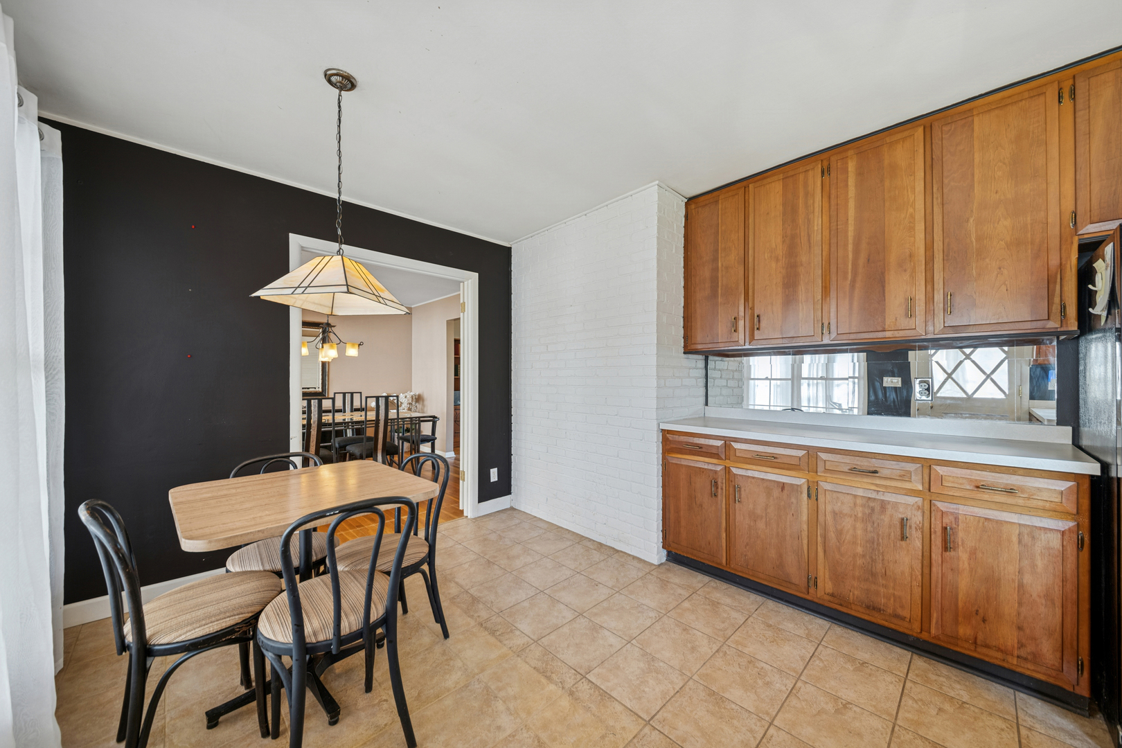 532 Shabbona Trail Batavia, IL 60510 - Photo 6 of 19 a kitchen with stainless steel appliances granite countertop a sink table and chairs