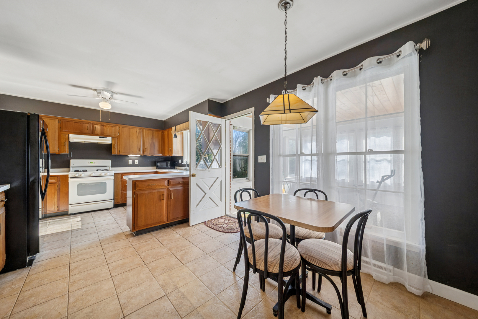 532 Shabbona Trail Batavia, IL 60510 - Photo 7 of 19 a kitchen with granite countertop a sink cabinets and stainless steel appliances