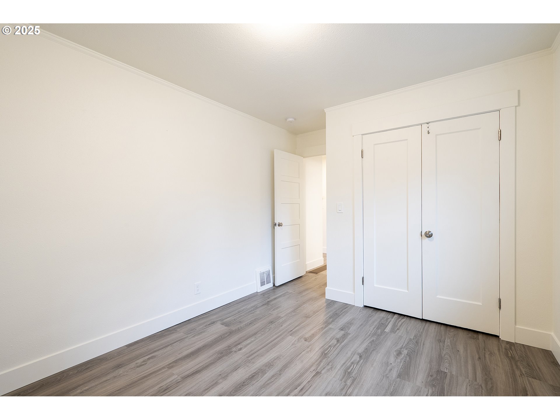 11129 Southeast Stark Street Portland, OR 97216 - Photo 12 of 20 a view of an empty room