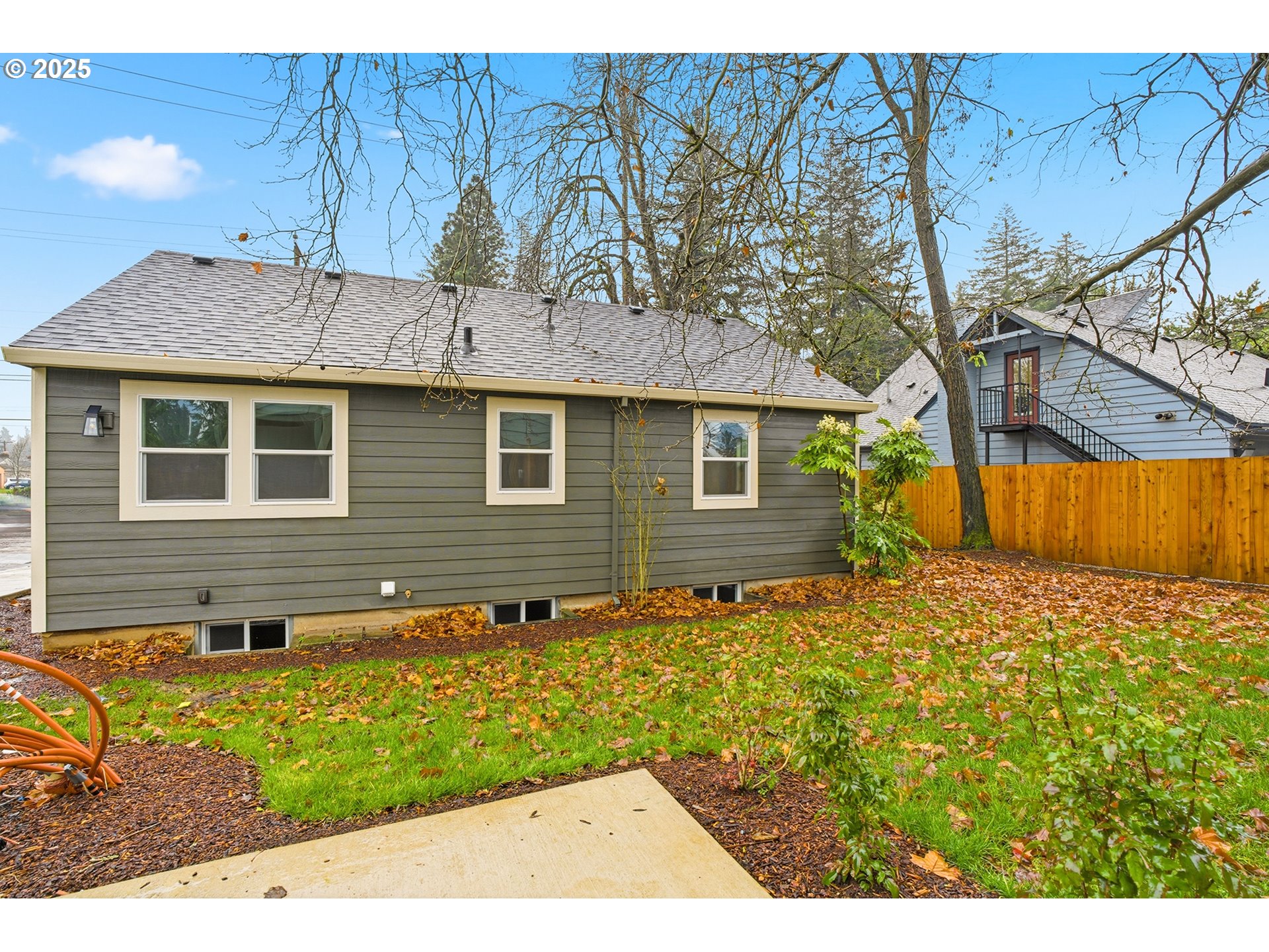 11129 Southeast Stark Street Portland, OR 97216 - Photo 20 of 20 a front view of a house with garden