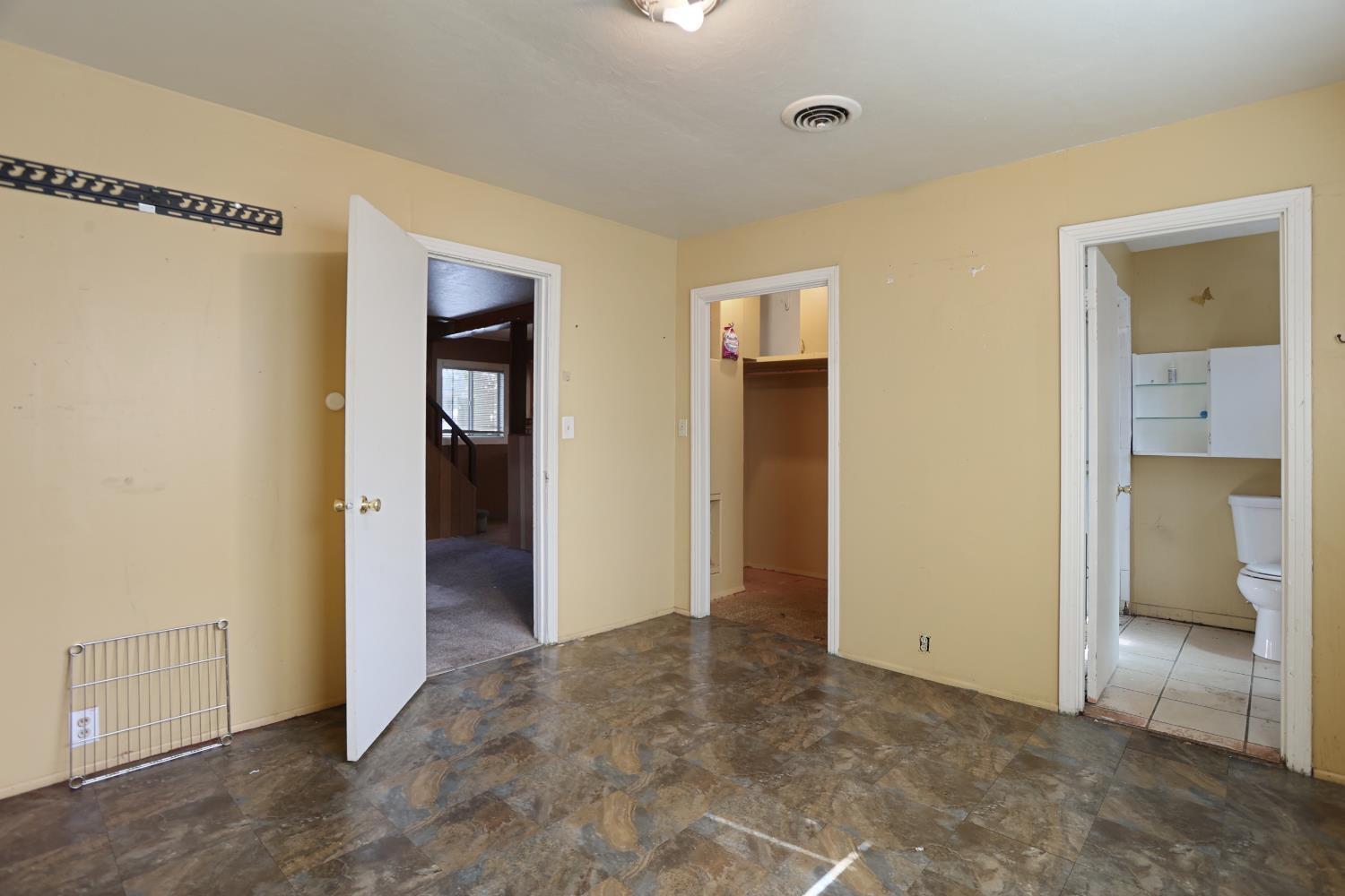 2018 East Myrtle Street Stockton, CA 95205 - Photo 14 of 41 a view of an empty room with closet and a bathroom
