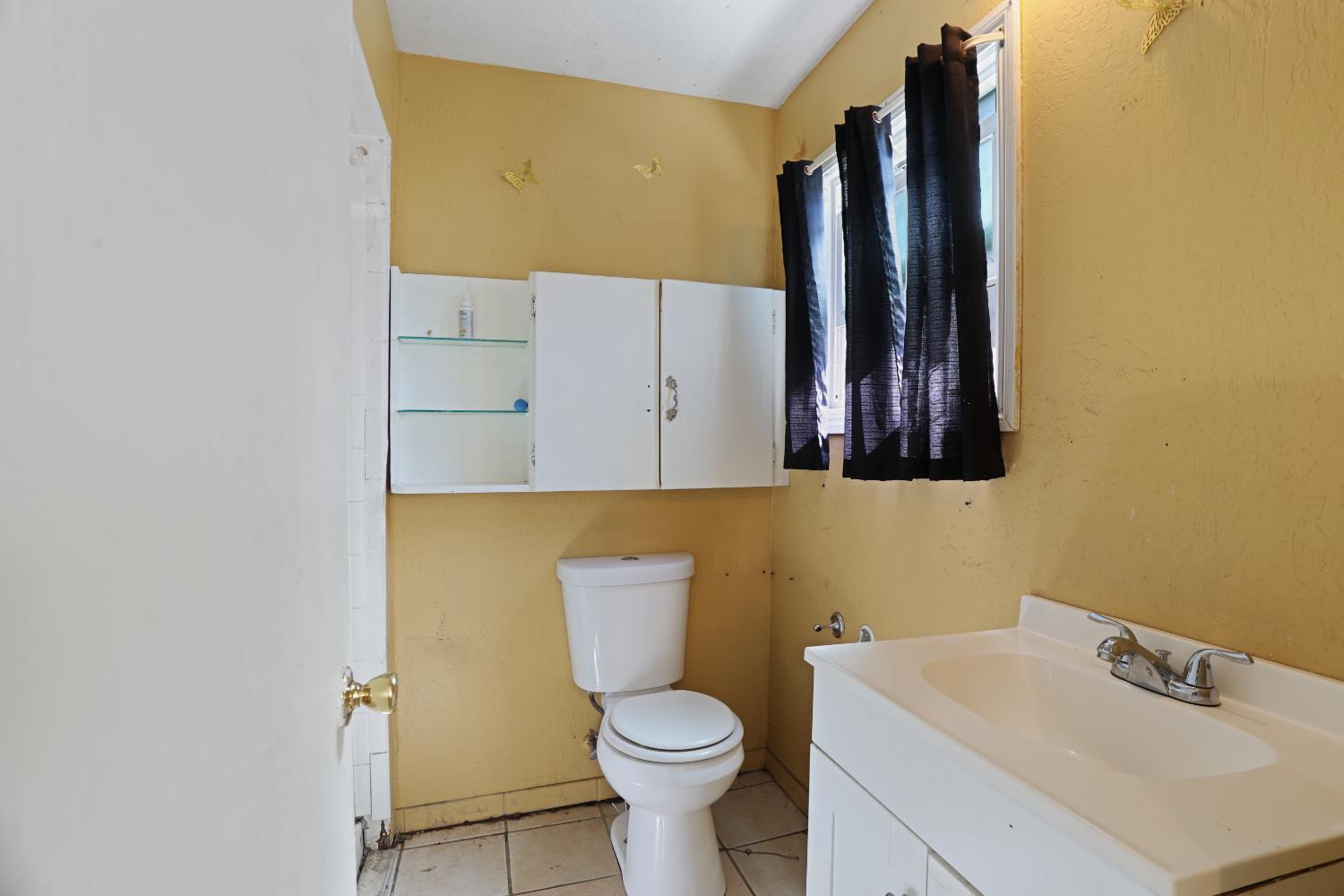 2018 East Myrtle Street Stockton, CA 95205 - Photo 16 of 41 a bathroom with a sink and a toilet