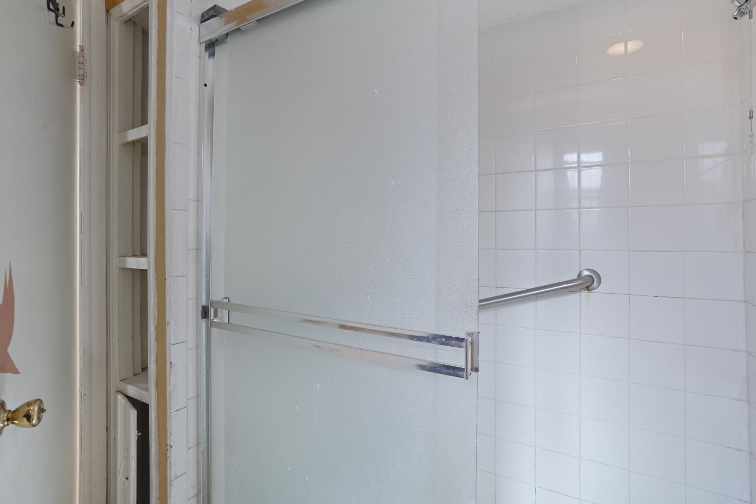 2018 East Myrtle Street Stockton, CA 95205 - Photo 17 of 41 a bathroom with a glass shower door