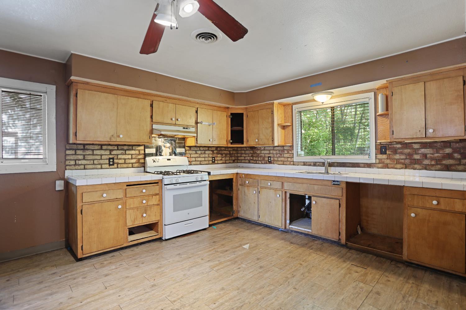 2018 East Myrtle Street Stockton, CA 95205 - Photo 21 of 41 a kitchen with stainless steel appliances granite countertop a stove and a sink