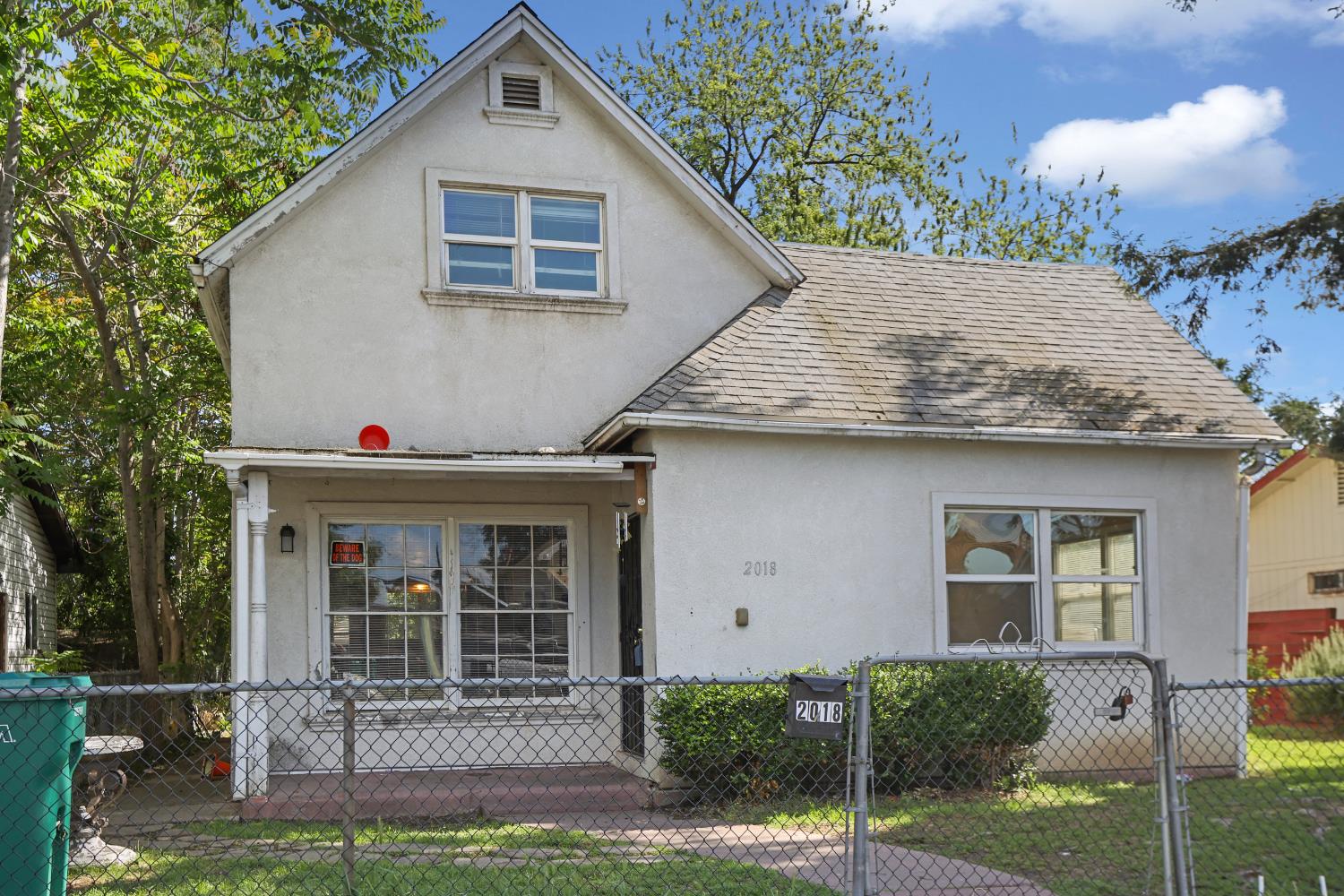 2018 East Myrtle Street Stockton, CA 95205 - Photo 3 of 41 a front view of a house with a yard