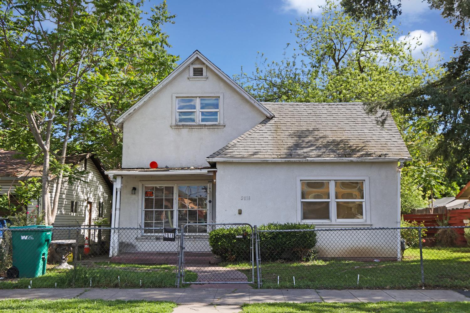 2018 East Myrtle Street Stockton, CA 95205 - Photo 4 of 41 a front view of a house with a yard and outdoor seating