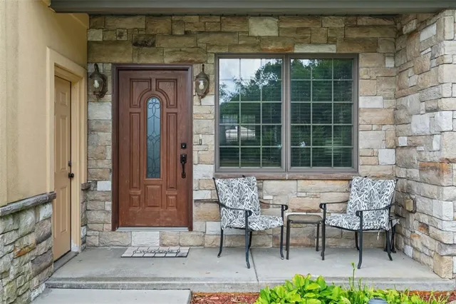 a view of a front door and a chair