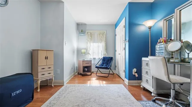 a bedroom with furniture and a dresser
