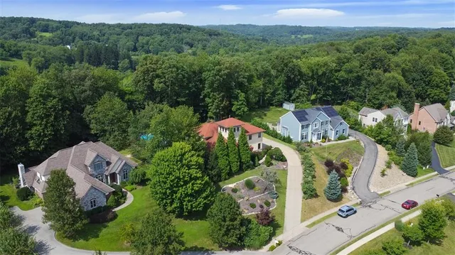 an aerial view of a house with a garden