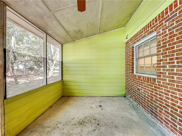 a view of a room with windows