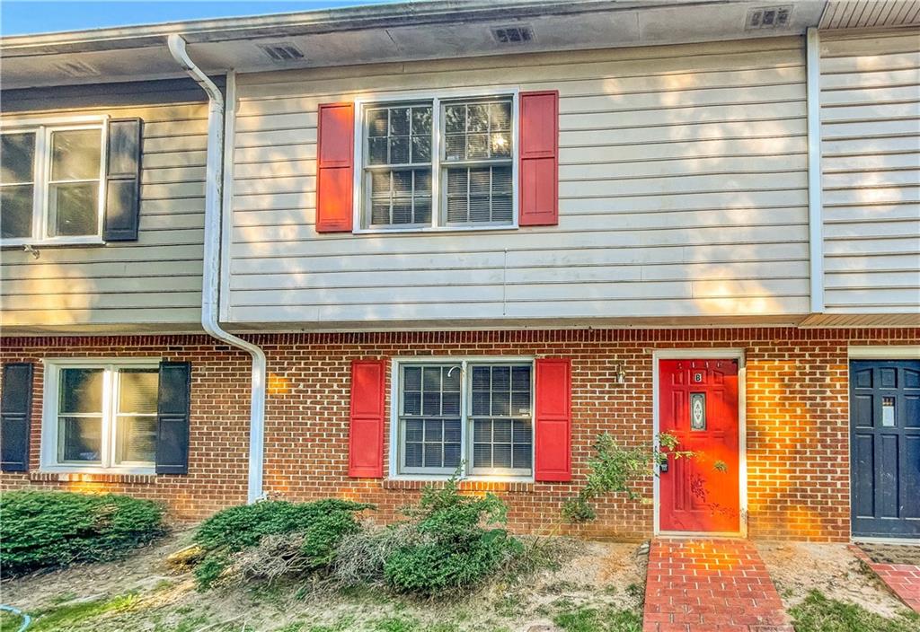 2140 Kings Gate Circle Southwest, Unit B Snellville, GA 30078 - Photo 2 of 18 a front view of a house