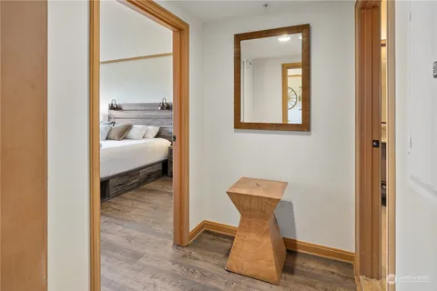a view of living room with furniture and wooden floor