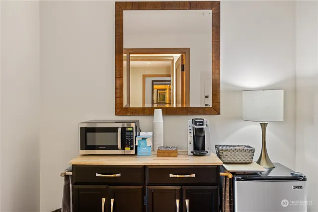 a kitchen with a sink and a microwave