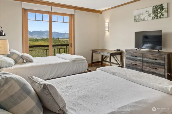 a bedroom with a bed and a fireplace